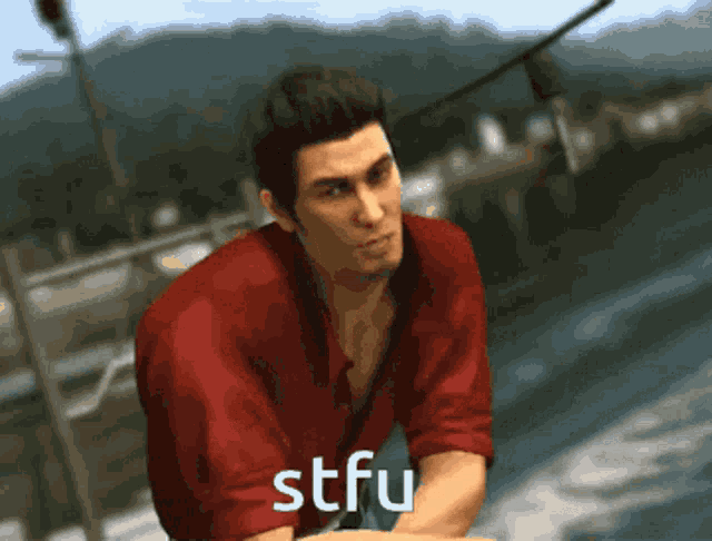 a man in a red shirt with stfu written on the bottom of his shirt