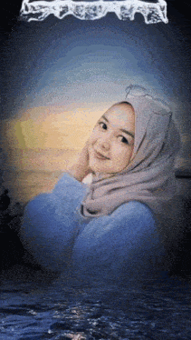 a woman wearing a hijab and glasses is standing in the water