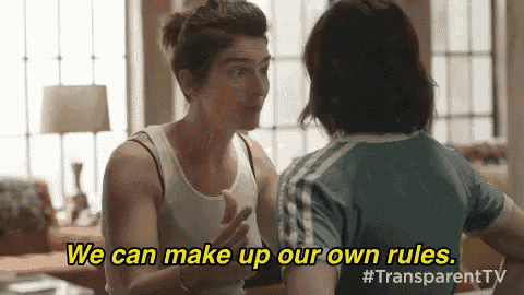 two women are talking to each other in a living room and one of them says `` we can make up our own rules '' .