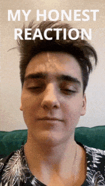 a young man with his eyes closed has a white spot on his forehead that says my honest reaction