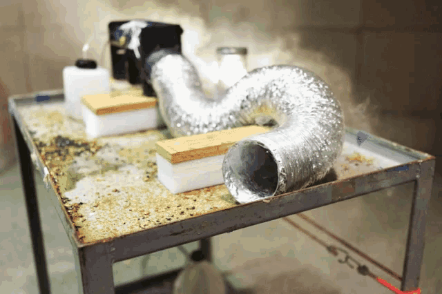 a hose is sitting on a table with a sponge on it