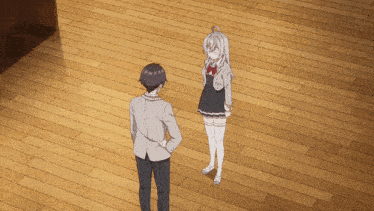 a man and a girl are standing on a wood floor