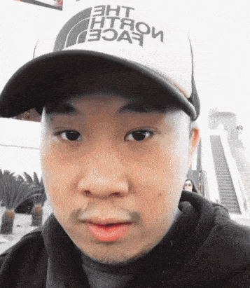 a man is wearing a hat that says the north face on it