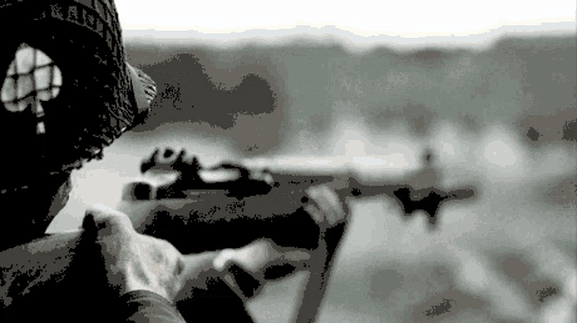 a pixelated image of a person holding a rifle with the word raid on their hat