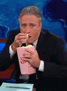 The Daily Show Eating GIF - The Daily Show Eating Popcorn GIFs