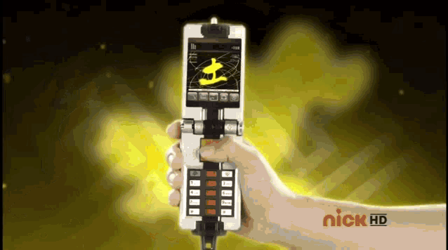 a hand is holding a phone that says nick hd on the screen