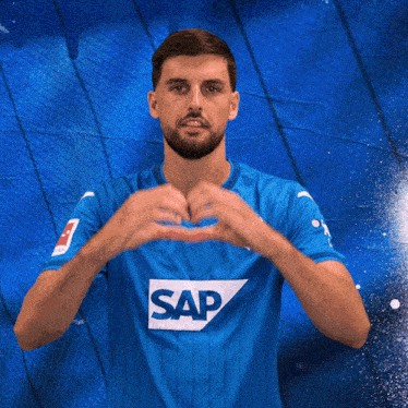 a man in a blue shirt with the word sap on the front