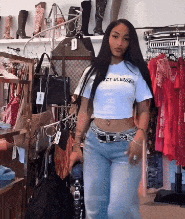 a woman in a crop top that says perfect blessing
