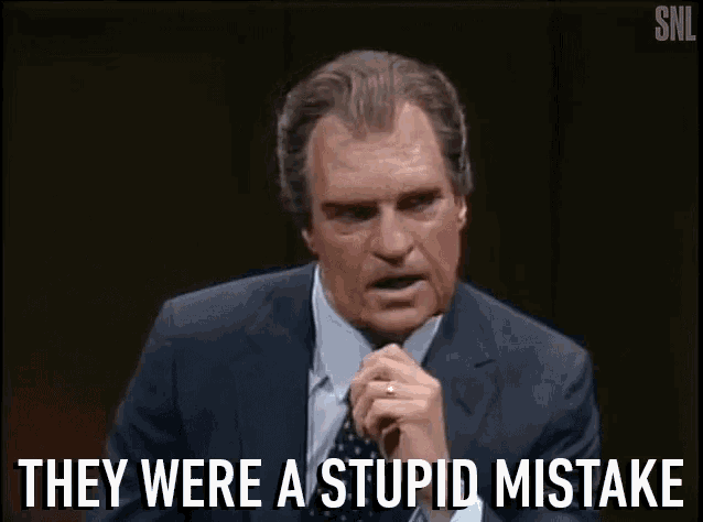 a man in a suit and tie is talking and says they were a stupid mistake .