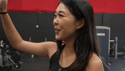 a woman giving a high five to another woman