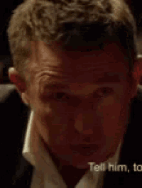 a close up of a man 's face with the words tell him to appear behind him