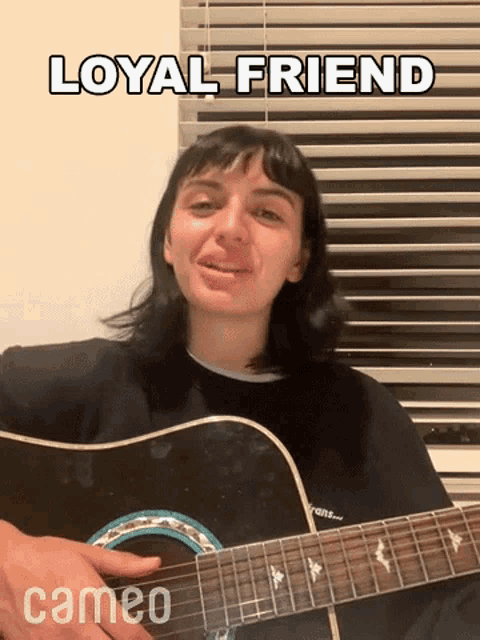 a woman is playing a guitar in front of a window with blinds and a caption that says loyal friend