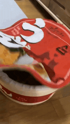 a bowl of ramen with the number 3 on the lid