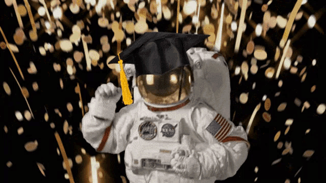 an astronaut wearing a graduation cap and gown with nasa on his helmet
