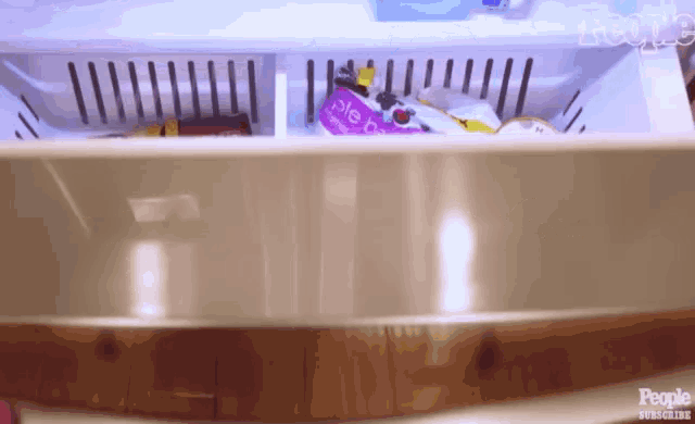 the inside of a refrigerator with a bag of pie crust in it