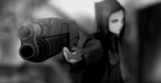 a person in a hooded jacket is pointing a gun