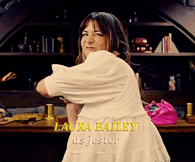 a woman in a white dress with laura bailey as jester