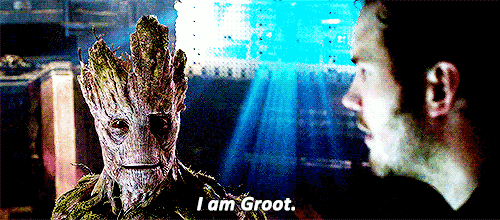 groot is standing next to a man and says i am groot