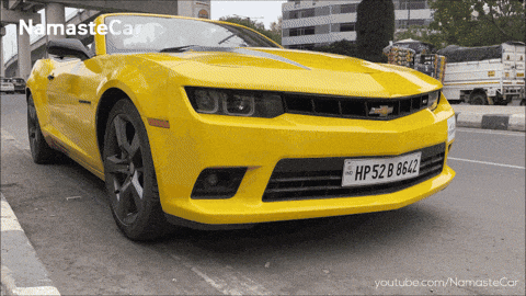 a yellow car with the license plate hp52b8642