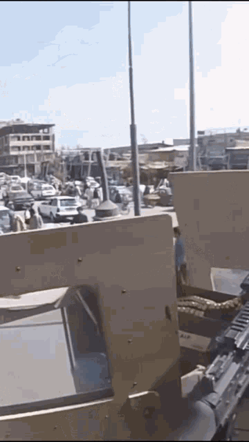 a military vehicle is driving down a street
