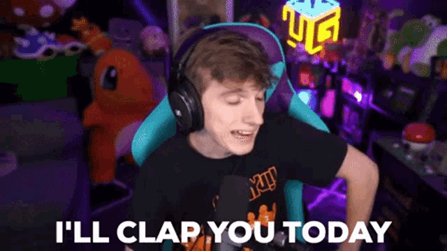 a man wearing headphones says " i 'll clap you today " while sitting in a chair