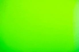 a close up of a bright green background with a blurred effect .