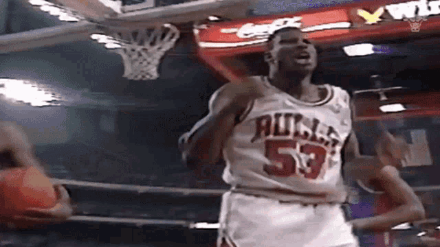 a basketball player wearing a bulls jersey is giving a thumbs up
