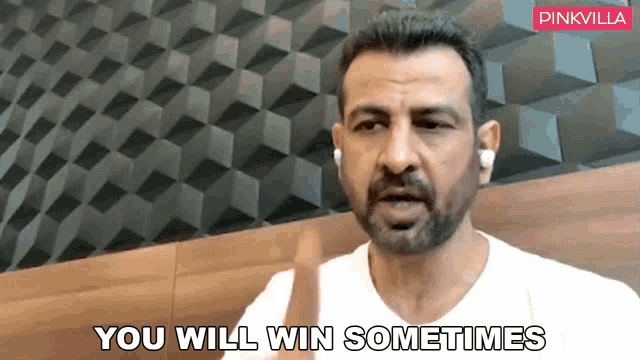 a man with a beard is sitting in front of a wall and says " you will win sometimes "
