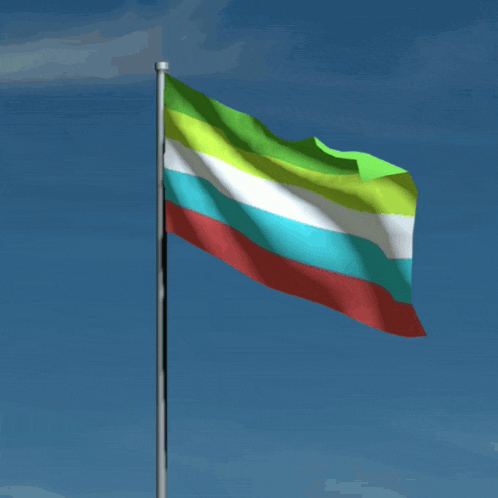 a colorful flag is waving against a blue sky