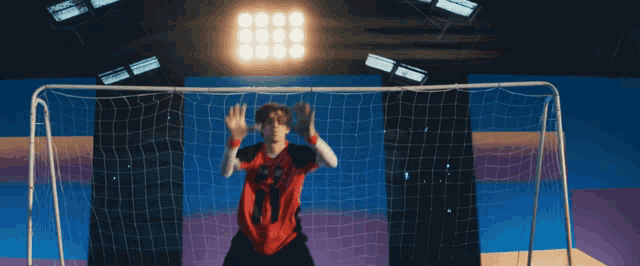 a soccer goalie wearing a jersey with the number 3 on it