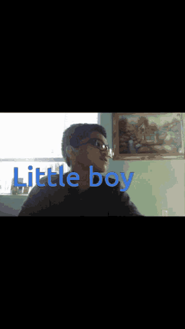 a picture of a boy with glasses and the words little boy below him