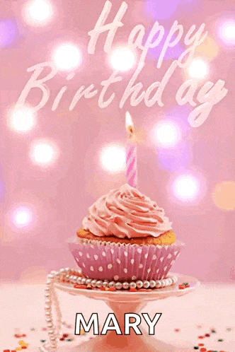 a cupcake with a pink frosting and a candle with the name mary on it