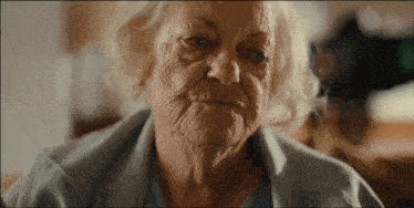 a close up of an elderly woman 's face