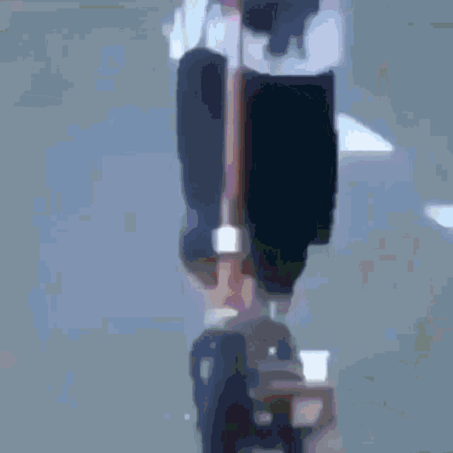 a young boy is riding a bike on a street .