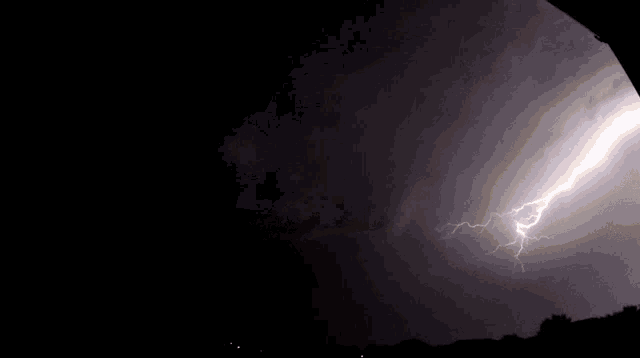 a black and white photo of a lightning strike