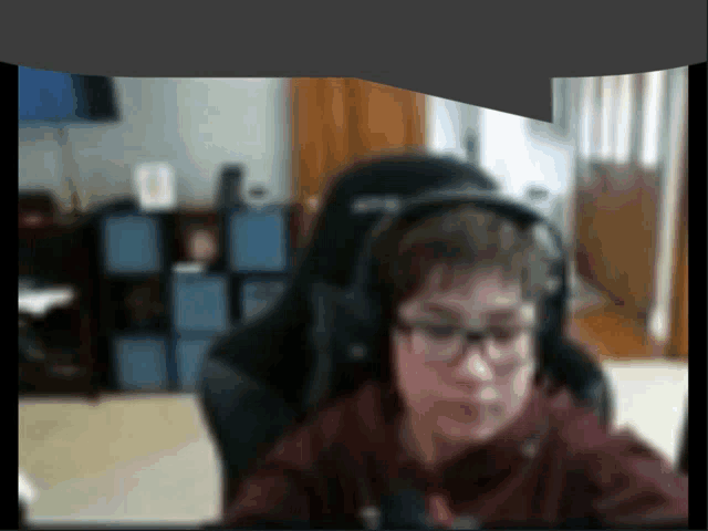 a blurry picture of a man wearing headphones