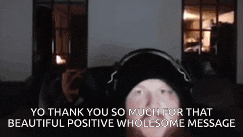 a man wearing headphones and a black hat says yo thank you so much for that beautiful positive wholesome message