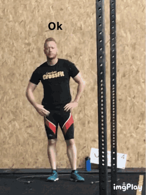 a man wearing a shirt that says crossfit