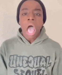 a young man wearing a hoodie that says unequal soul