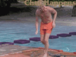 a man in orange shorts is jumping into a pool with the words check happens in the background