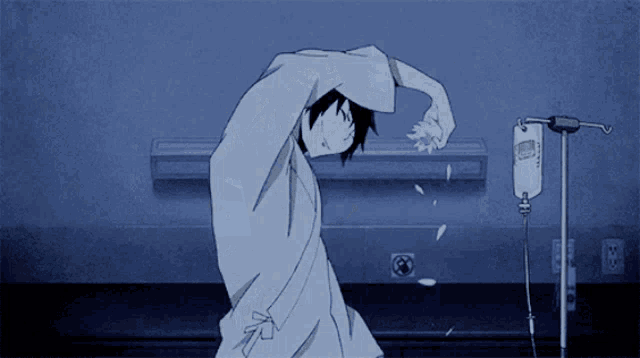 a person in a hospital gown is dancing in front of an iv drip
