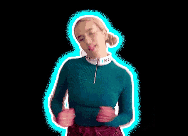 a pixelated image of a woman wearing a green sweater with a white collar that says love