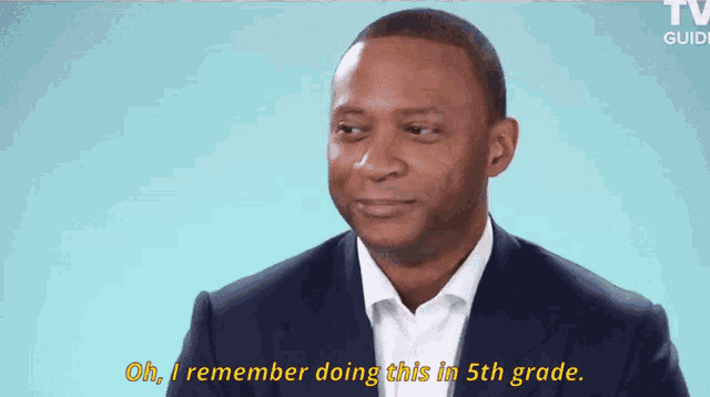 a man in a suit and white shirt is saying oh i remember doing this in 5th grade