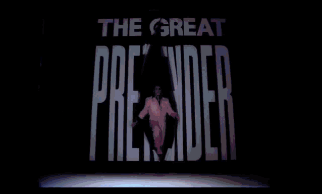 a man in a white suit is dancing with his arms outstretched .