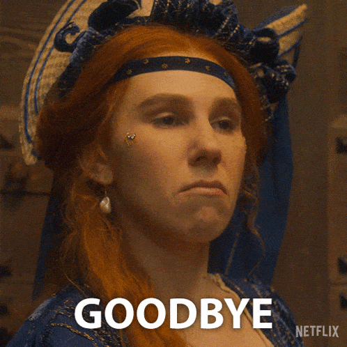 a woman with red hair is wearing a blue dress and earrings and says goodbye
