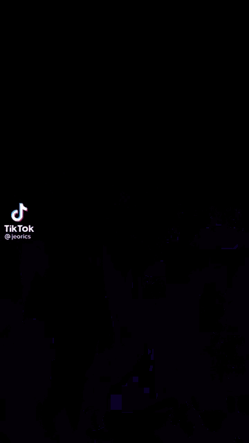 a tik tok video of a person dancing with their arms in the air