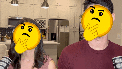 a man and a woman with yellow faces on their faces