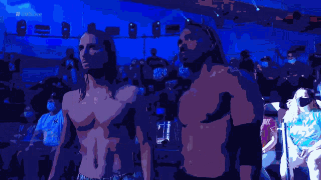 wrestlers demetri jackson and andrew lockhart are standing in front of a crowd