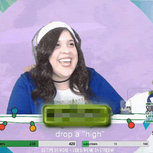 a woman is smiling in front of a sign that says drop a high