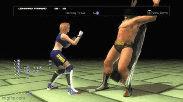 a video game screen shows a woman fighting a man in a boxing match